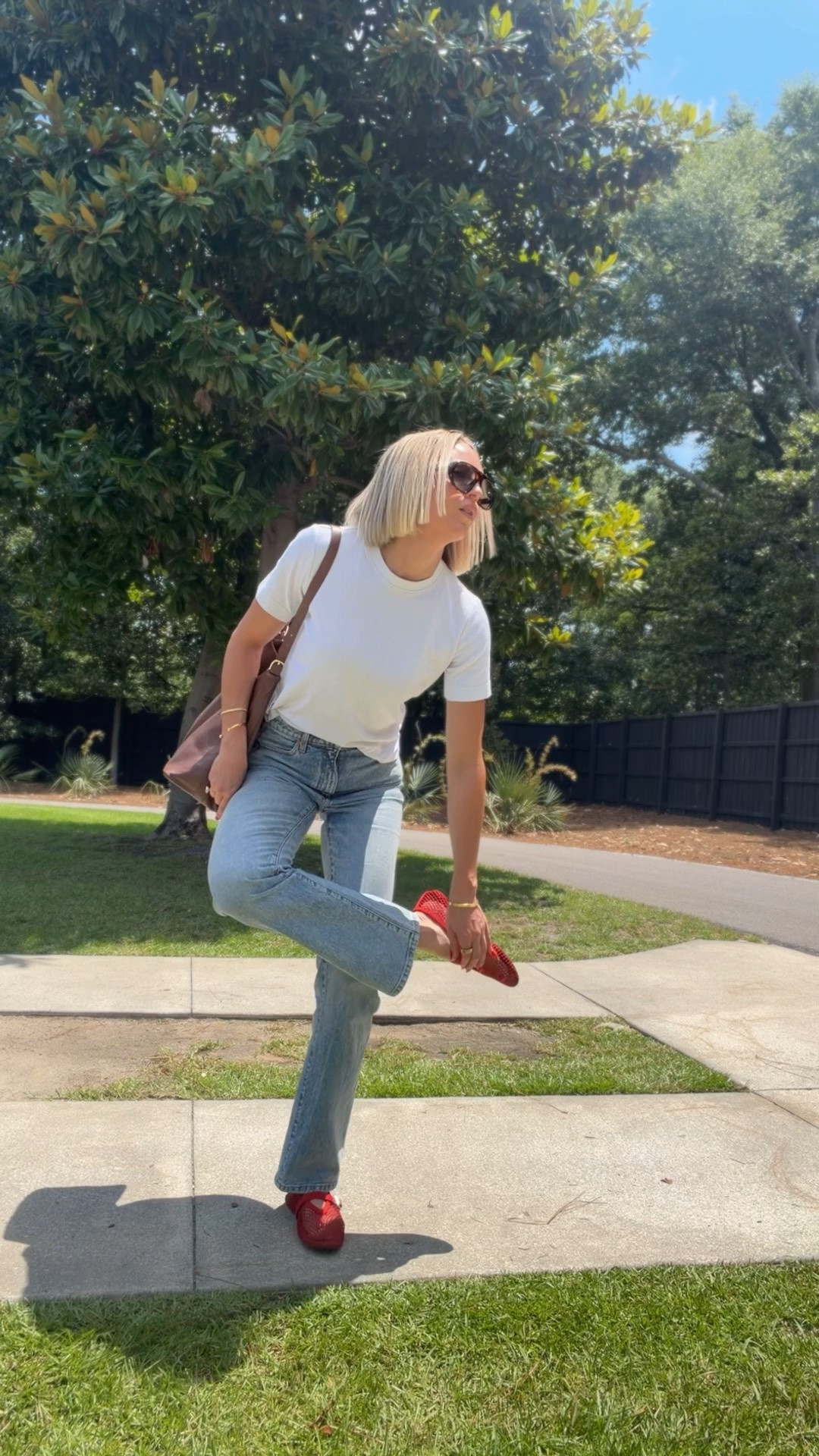 Bag is from vestirsi😍 wearing my usual size in the jeans. These are the comfiest designer shoes I officially own. run tts. Wearing a medium in the tee ￼￼

#LTKootd #LTKdayinmylife #LTKOver40