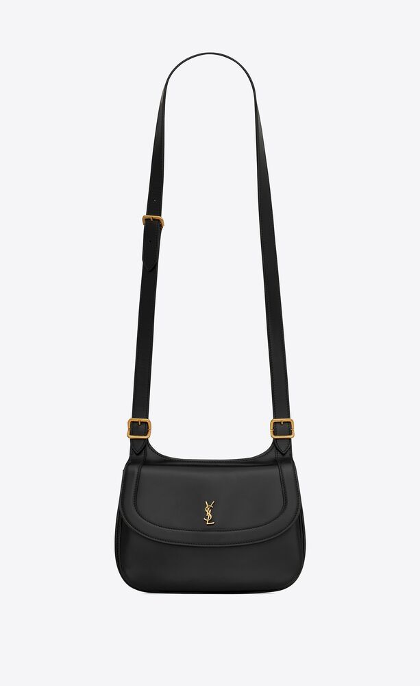 Charlie medium shoulder bag with a front flap featuring interlaced metal YSL initials, designed w... | Saint Laurent Inc. (Global)