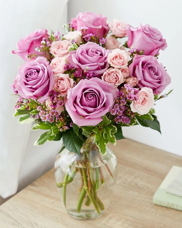 Give mom a beautiful arrangement of gorgeous hues of violet flowers this Mother’s Day. Its perfect purples and pretty pinks pop against floral greens. This bouquet is the perfect classic-meets-modern floral arrangement that mom will absolutely adore. ON SALE and under $50. Available in three sizes (deluxe size is shown). 

Includes:
• Purple Roses
• Pink Spray Roses
• Pink Waxflowers
• Seasonal Greens
• Glass Vase
• Personalized Card Message

#LTKMothersDay #LTKSaleAlert #LTKHome