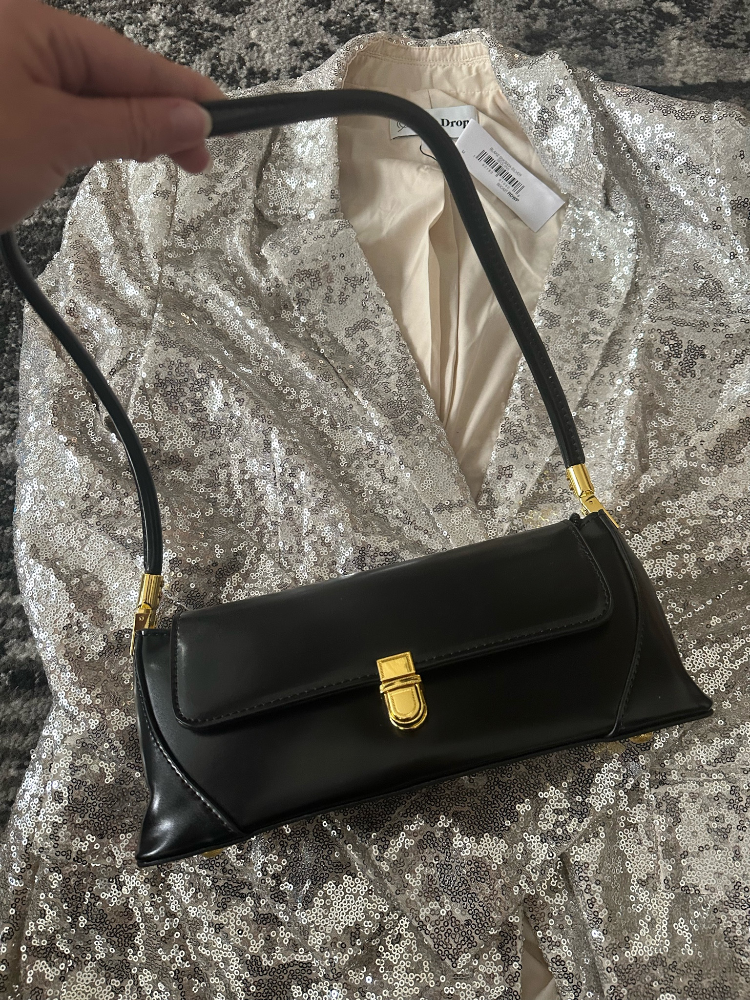 Amazon prime day purchases have arrived! 

Sequin blazer and the cutest black back only $25!

#LTKfindsunder50 #LTKSeasonal #LTKHoliday