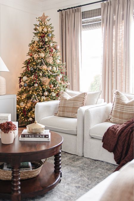 STILL IN STOCK ✨ Berea slouchy lounge chair from Target in linen. And our prelit christmas tree! Berea chair, cozy living room, christmas living room, maroon throw blanket, round wood coffee table, slipcovered accent chair, amazon curtains, pinch pleat drapes

#LTKHoliday #LTKhome #LTKSeasonal