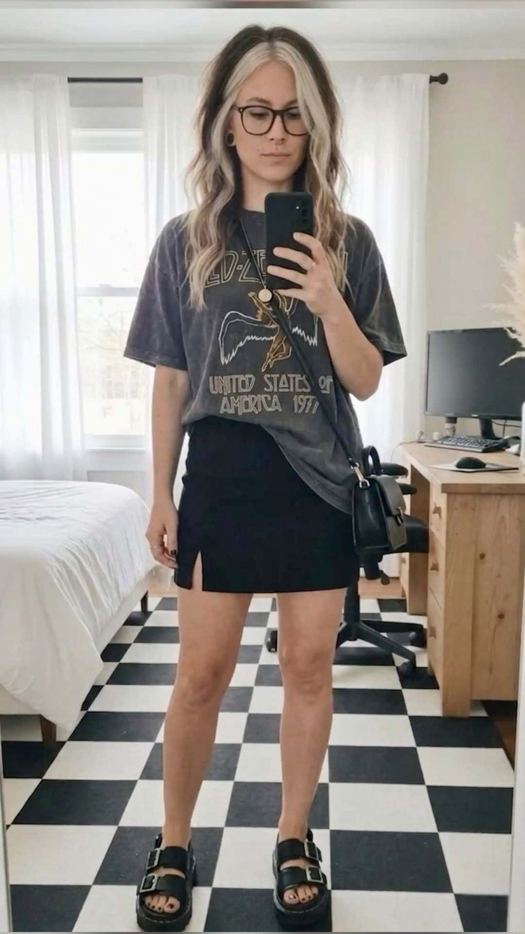 Serving up some major casual, edgy outfit inspiration for your summer-to-fall transition wardrobe! 🎸 If you love a mix of streetwear and grunge aesthetic, this effortless OOTD formula is for you.

I paired this oversized vintage Led Zeppelin graphic tee (tucked just a bit for that effortless slouchy look) with a high-waisted black mini skirt featuring a subtle side slit. It’s the perfect balance of casual and put-together.

To complete the look, I threw on my favorite chunky black platform buckle sandals (essential for that extra height and comfort!) and a classic black crossbody bag to keep it hands-free.

#LTKootd #LTKSeasonal #LTKMidsize