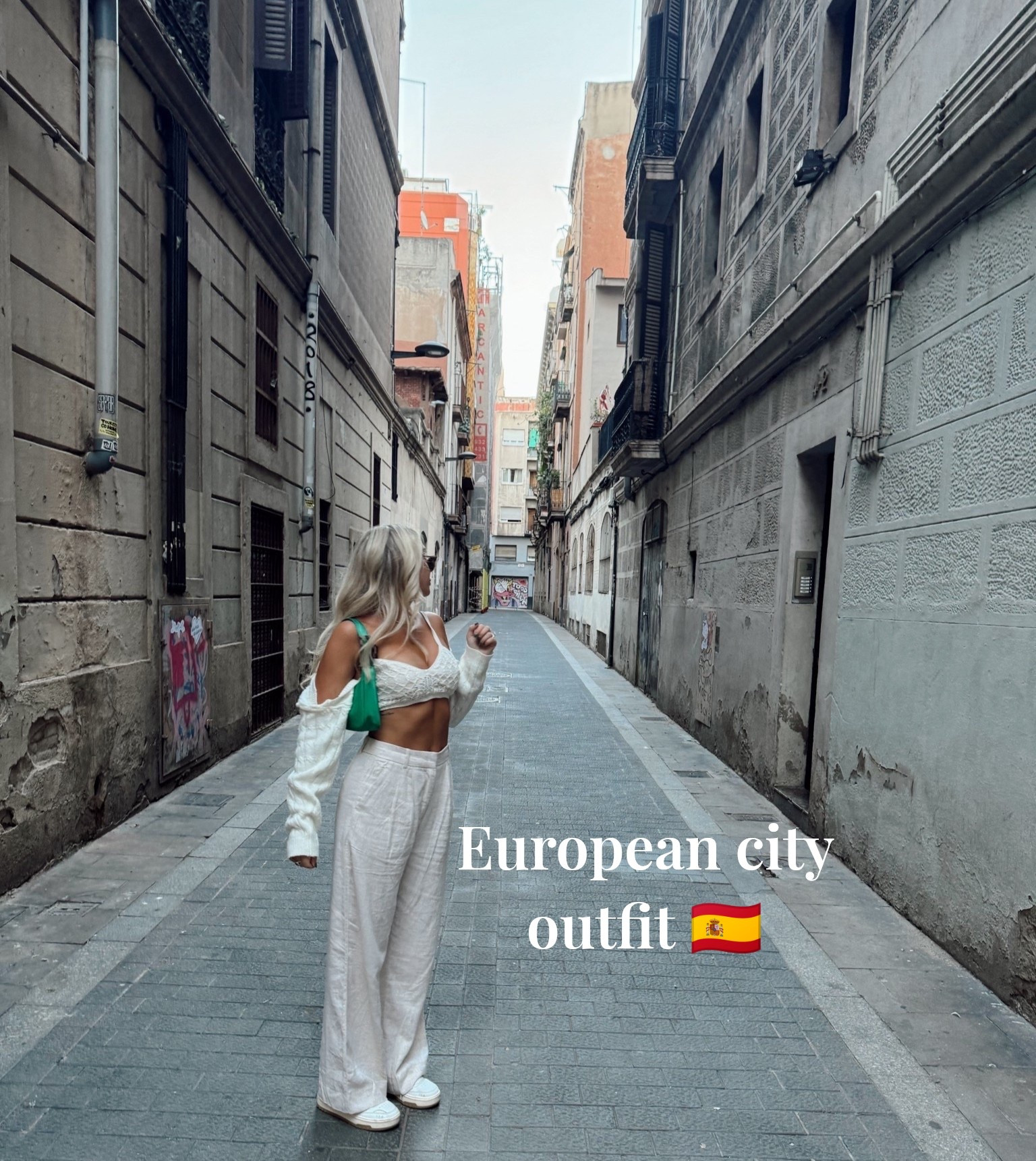 European travel outfit inspo 🇪🇸
Abercrombie trousers, white cropped cardigan + bralette, Reebok sneakers, and a pop of color with my green Prada bag. The perfect city vacation outfit - comfortable but elevated.

Linking similar trousers, sneakers, and chic travel staples.

#LTKTravel #LTKdayinmylife #LTKootd