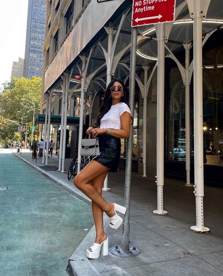 Edgy NYC street style— black leather skort (small), white crop (small) and white platform heels (8, size up 1/2 size)

#LTKunder50 #LTKshoecrush #LTKstyletip