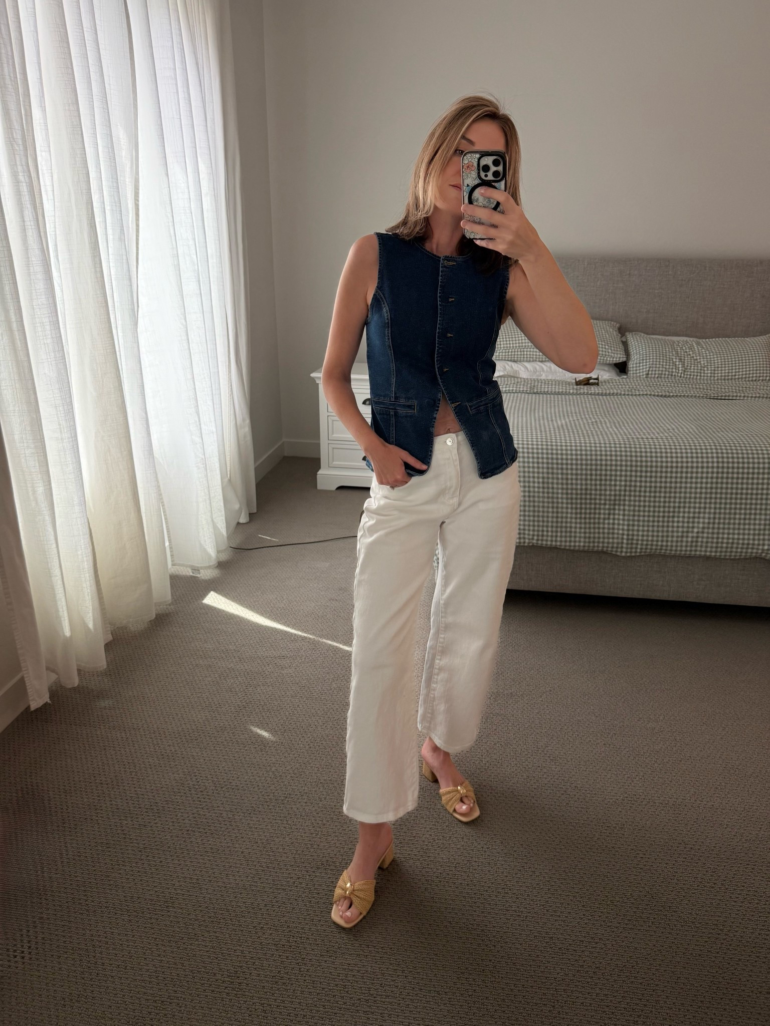 This look is the ultimate transition piece for spring! Combining a structured denim vest with crisp white wide-leg jeans creates a polished, "quiet luxury" vibe that works for everything from school drop-offs to a casual lunch date. The tailored fit of the vest balances out the relaxed silhouette of the pants perfectly.

Amazon Fashion, Spring Outfit Ideas, Denim Vest Trend, White Wide Leg Jeans, Coastal Chic Style, Quiet Luxury Outfits, Millennial Style, Mom Life Fashion, Raffia Sandals, Spring Capsule Wardrobe, LTKunder50, Amazon Finds