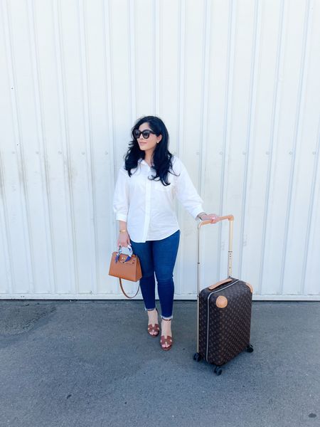Back home ✈️. Wore this on my travel day. Obsessed with this top from @aninebing. I love a white button up shirt! 

#LTKsalealert #LTKSeasonal #LTKstyletip