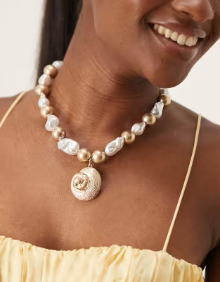 ASOS DESIGN necklace with pearl detail and shell pendant in brushed gold tone | ASOS (Global)