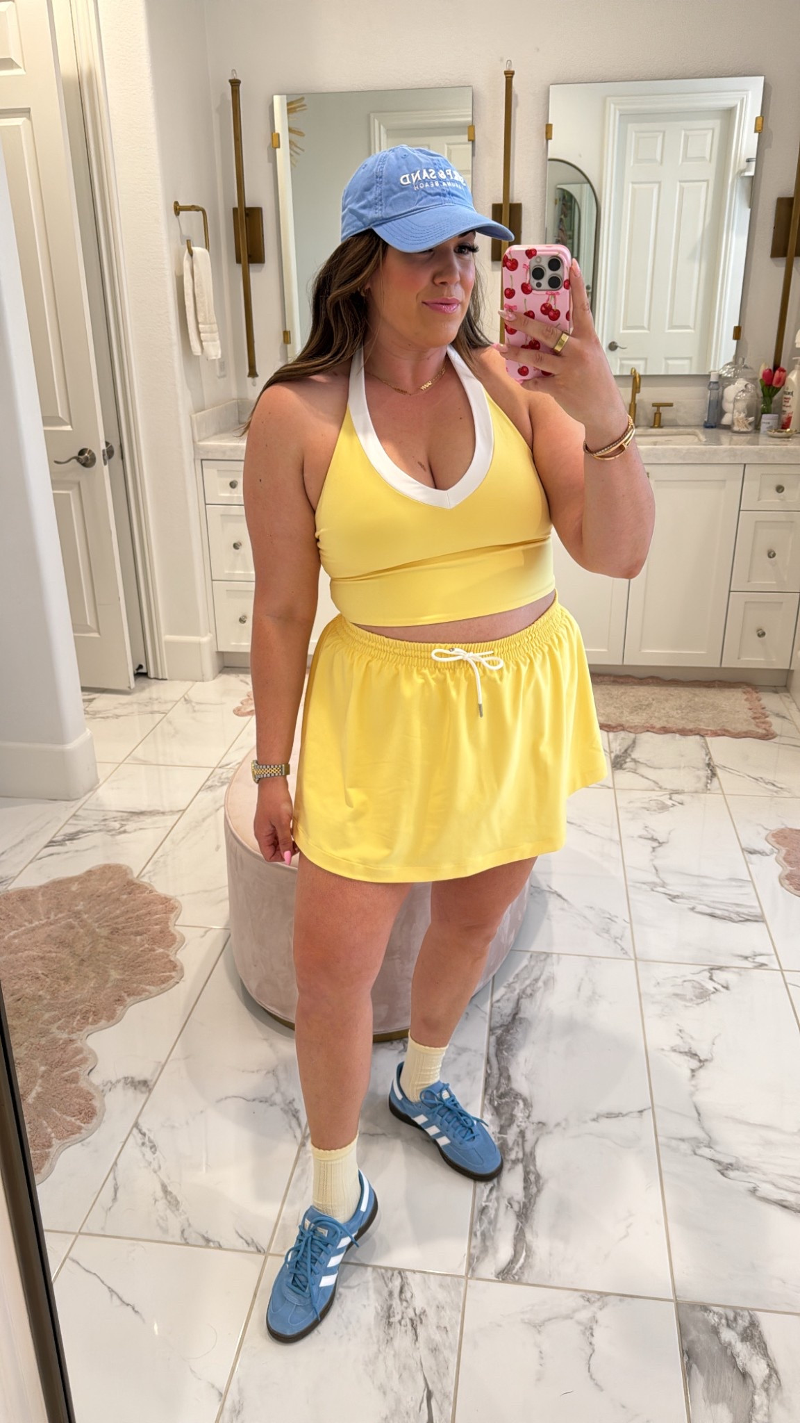 curvy midsize butter yellow and light blue athleisure look for spring! wearing size large in halter top and skirt (which has built in shorts!) 

#LTKSeasonal #LTKMidsize #LTKFindsUnder50