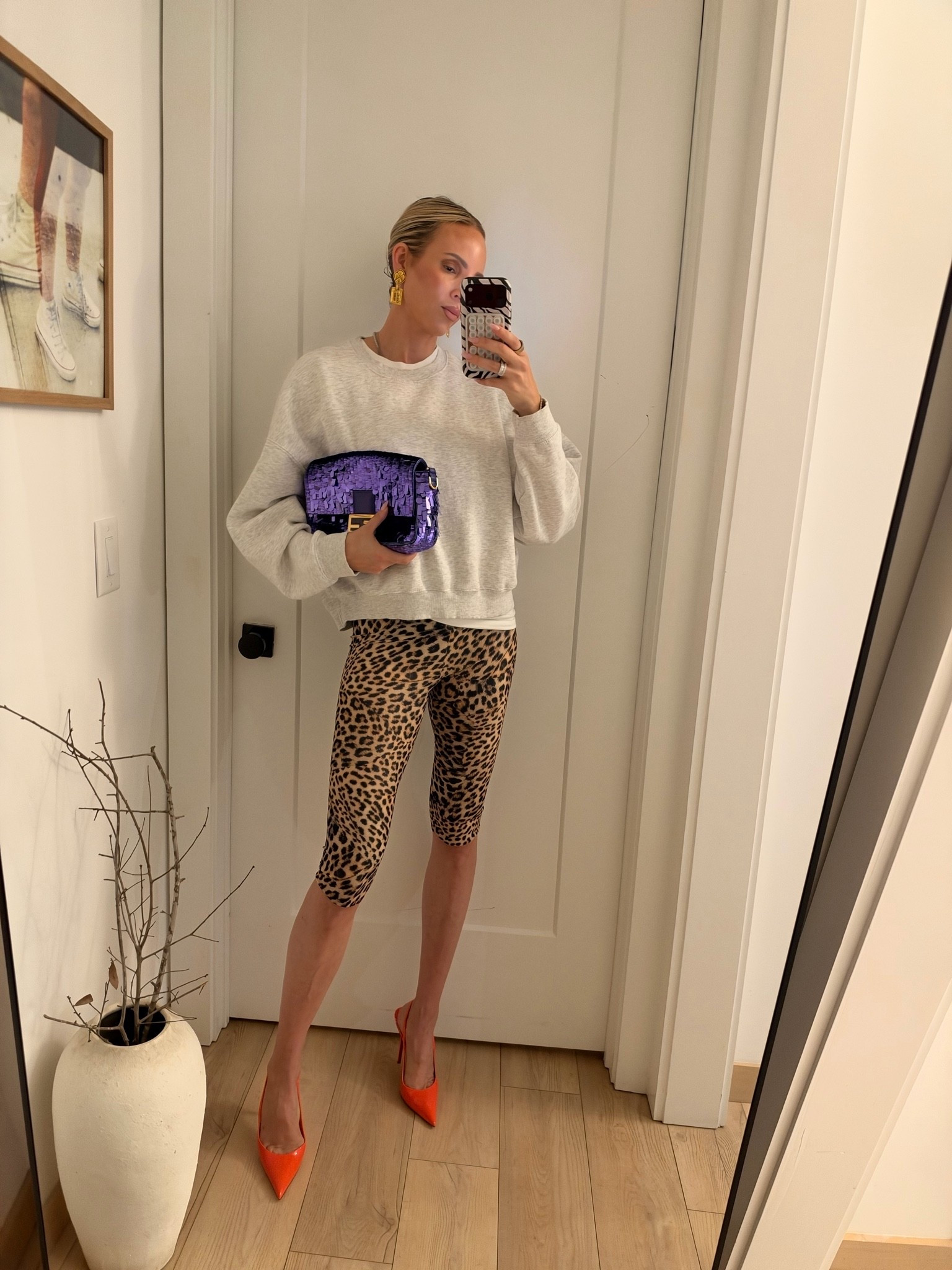 Wearing a medium in the Zara sweatshirt. The capris run so big. I should have ordered two sizes down. I am wearing an xs when I normally wear a small. I should have ordered an xxs. Heels run tts