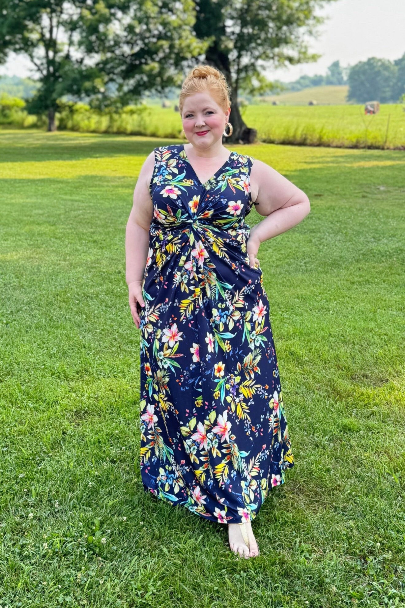 Navy Tropical Maxi Dress Outfit

I’m wearing this Floral Sleeveless Draped Maxi Dress (sizes 12-26; $99.95) in the size 16. It runs true to size, and the fabric is a smooth and stretchy poly knit. It hits at my ankle and I’m 5’4″, so I can wear it with flats. This dress is so comfortable and easy to move in, but the silhouette is so elegant and elongating. The tropical floral print is colorful and fun, but the navy backdrop keeps approachable and wearable beyond vacation too. Use code WWWULLA to get it for just $65!

#LTKMidsize #LTKPlusSize #LTKootd