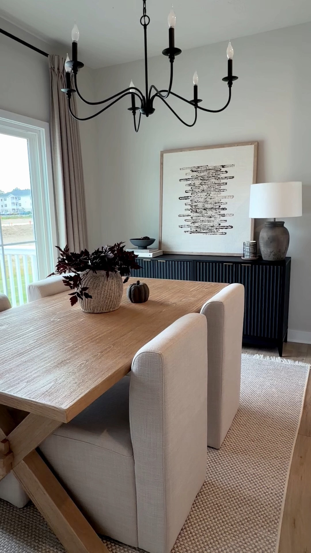 Collected California style, dining room, sideboard, console, upholstered chairs, washable rug, amber lewis rug, brown lamp, amber Lewis art, Getty art, concrete vase, two pages curtains, wood table, rectangle table, dining room table, plum stems, arhaus vase, black chandelier

#LTKSaleAlert #LTKHome #LTKSeasonal