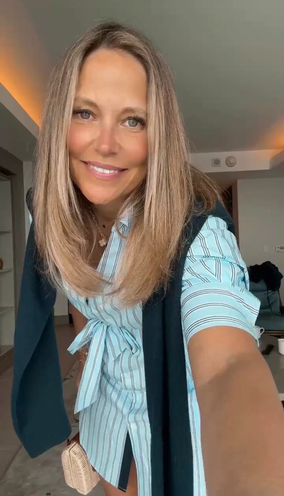 I am loving this shirtdress I wore the other day! I paired this striped dress with a navy sweater wrapped around my shoulders, a simple necklace, and some flats! Perfect look for warmer weather days!

#LTKSeasonal #LTKMidsize #LTKOver40