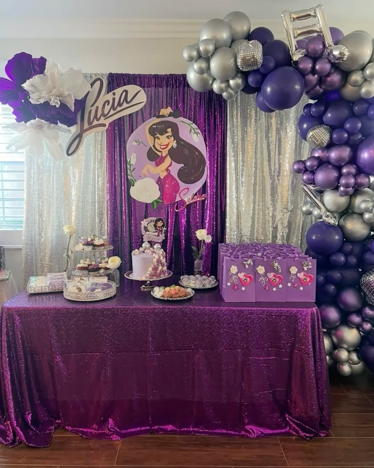 Selena birthday dessert table and balloon backdrop 