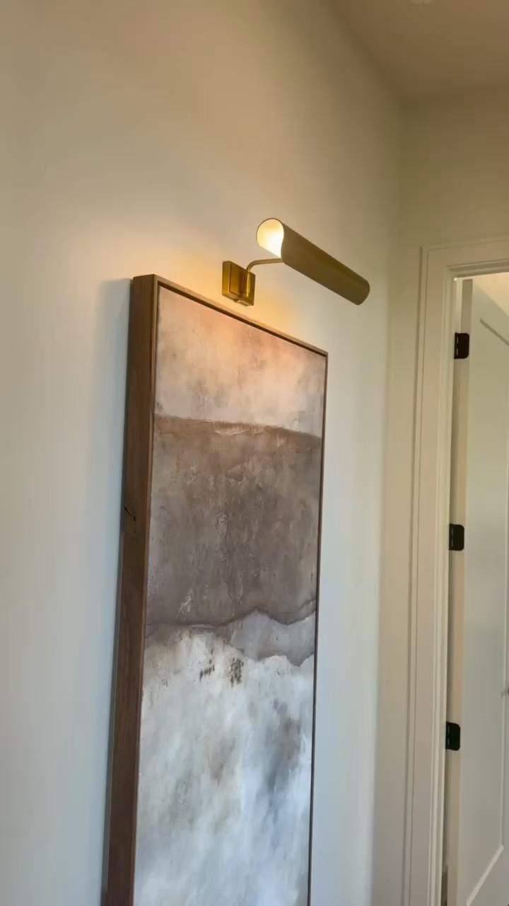 I’m using this picture light to highlight artwork and bring a soft, finished glow to the wall.

I chose the warm brass tone and slim profile so it adds light without distracting from the piece. It’s a simple detail that makes the space feel more intentional.

Linked here if you’re looking for an easy way to elevate your 
@Wayfair 
@Lulu and Georgia

#LTKU #LTKHome #LTKSaleAlert