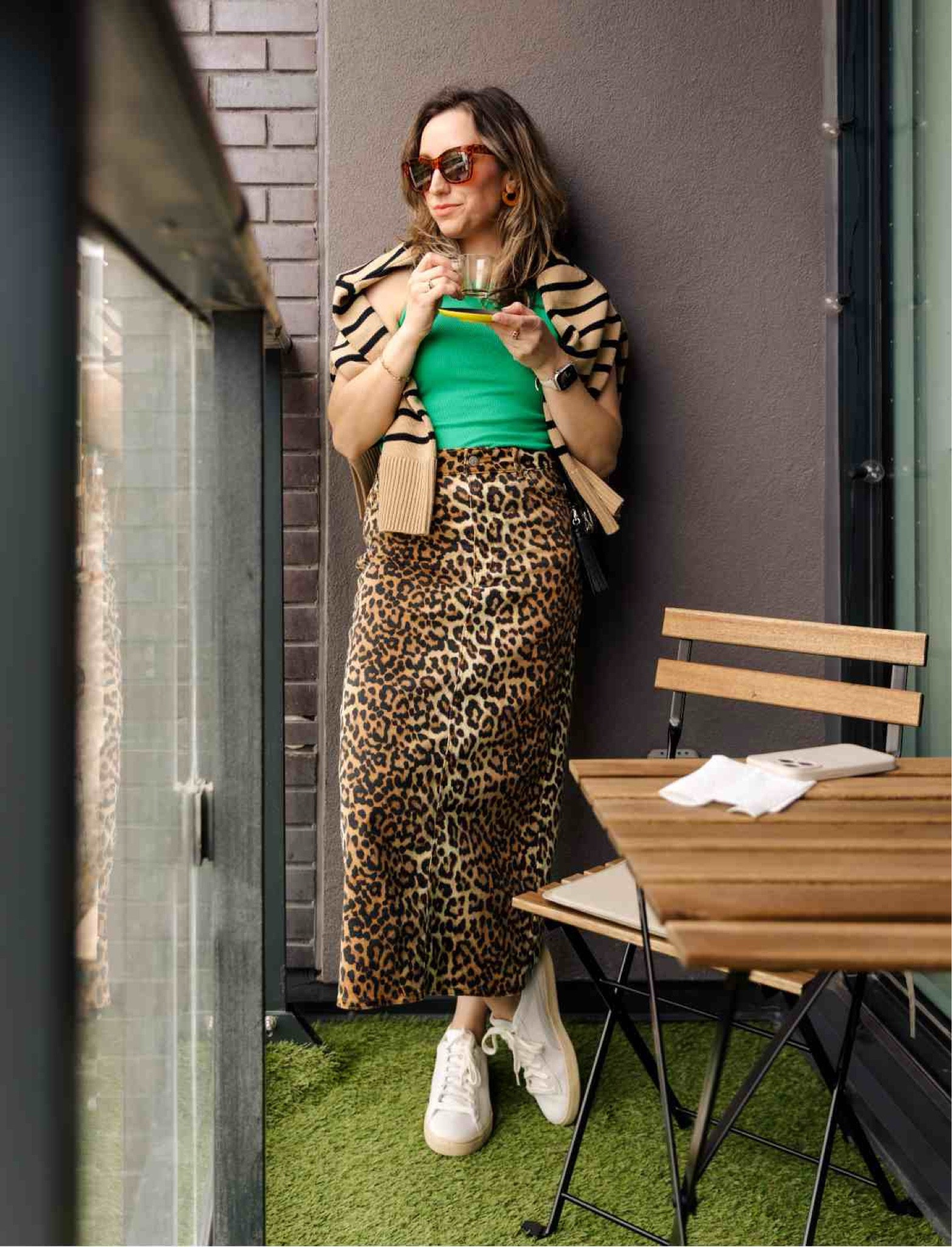 Leopard print skirt outfit with a striped tan back crew sweater  and green tank top. 

Leopard midi skirt, leopard print maxi skirt, leopard outfit, leopard print midi skirt, white sneakers  outfit, striped stripes, spring outfit, summer outfit

#LTKOver40 #LTKFindsUnder50