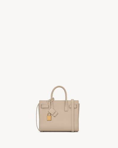 SIGNATURE SAINT LAURENT BAG FEATURING ACCORDION SIDES WITH SNAP BUTTON COMPRESSION TAB CLOSURE AN... | Saint Laurent Inc. (Global)
