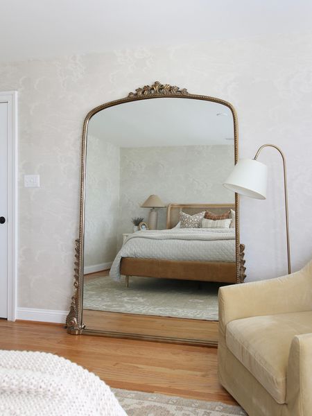 Across from the cane headboard and leather framed bed is my favorite 7ft Anthropologie gleaming primrose mirror. The wallpaper vid from McGee and Co and the metal floor lamp from Overstock 

#LTKhome #LTKstyletip #LTKFind
