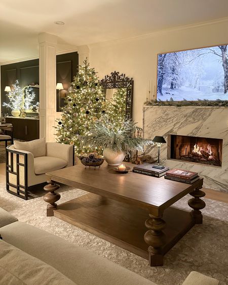 Nighttime holiday living room views ✨

Christmas tree, coffee table styling, rug, accent chair, frame TV

#LTKstyletip #LTKHoliday #LTKhome