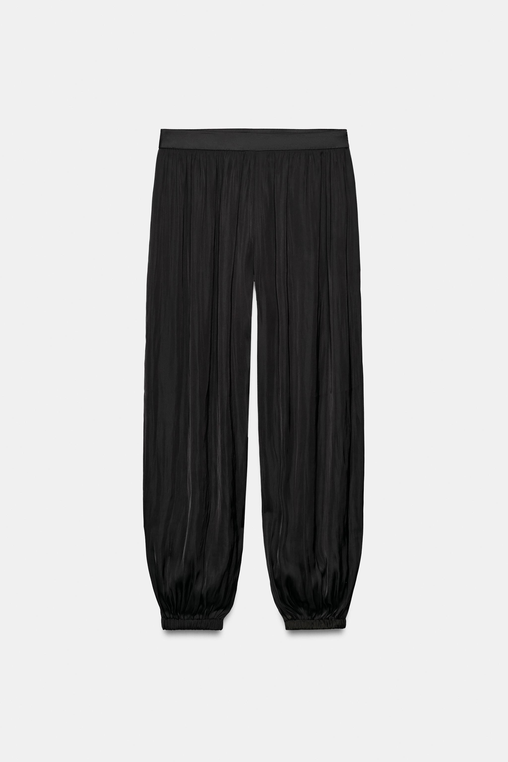 Mid-rise flowy pants. Balloon-style legs with elastic cuffs. Hidden side in-seam zip closure. | Zara US
