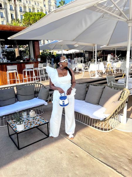 Statement white tank top
All white outfit 

#LTKstyletip #LTKsalealert