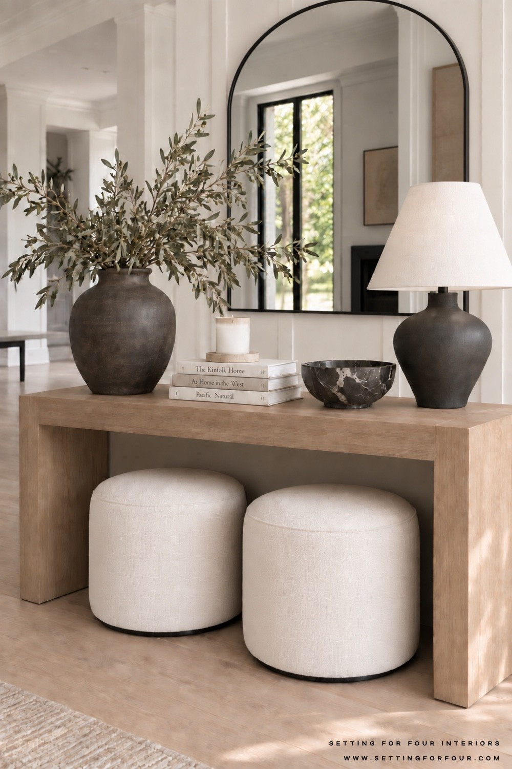 Neutral console table decor with arch mirror. Entryway, hallway, living room, table lamp, ottoman, wall art, earthy, moody, organic modern, transitional, Nancy Meyers style, Wayfair home, Pottery Barn style