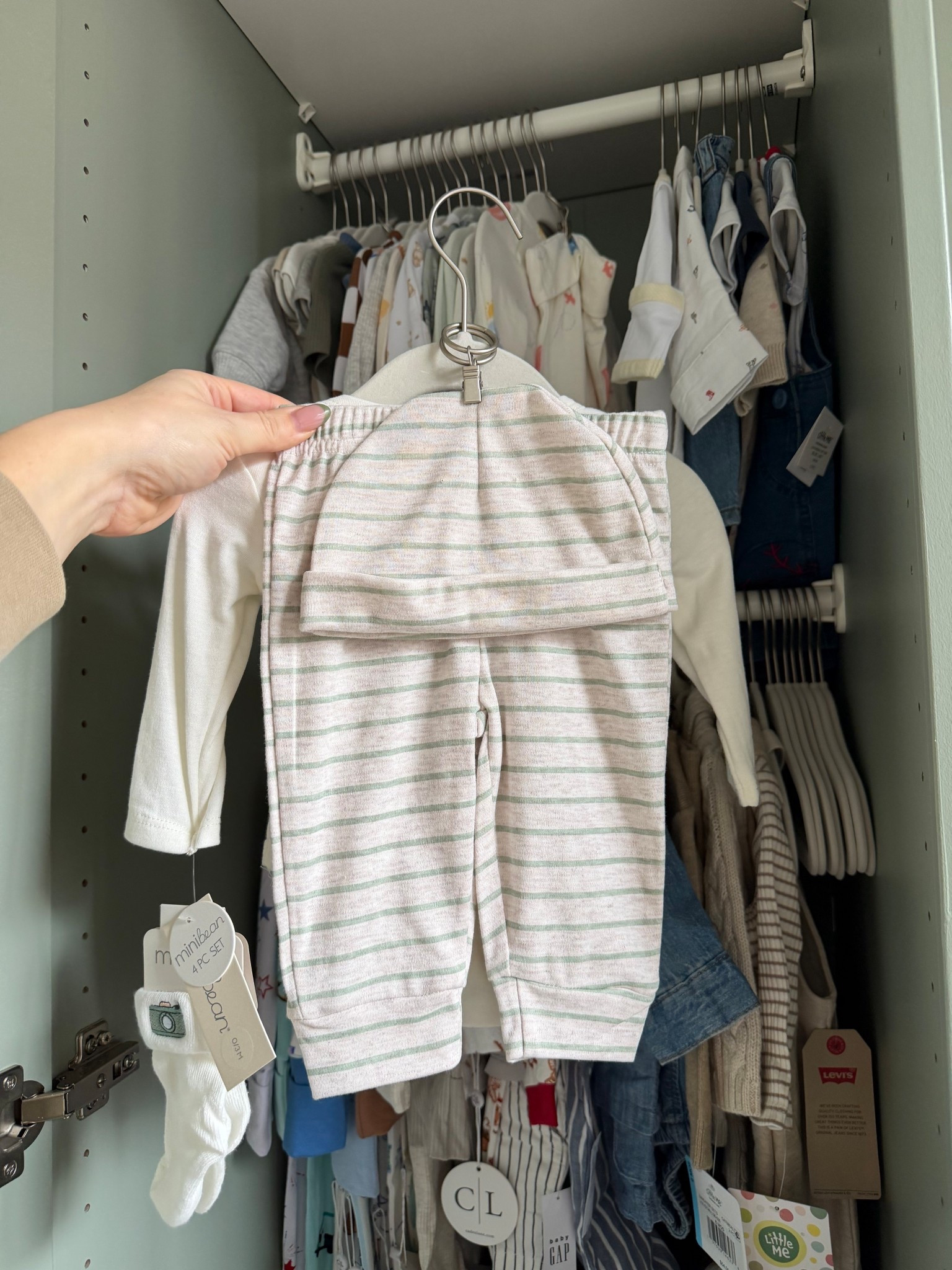 Baby clothes space saving hack! Hook the pants to the top with a small curtain hook 

#LTKBaby