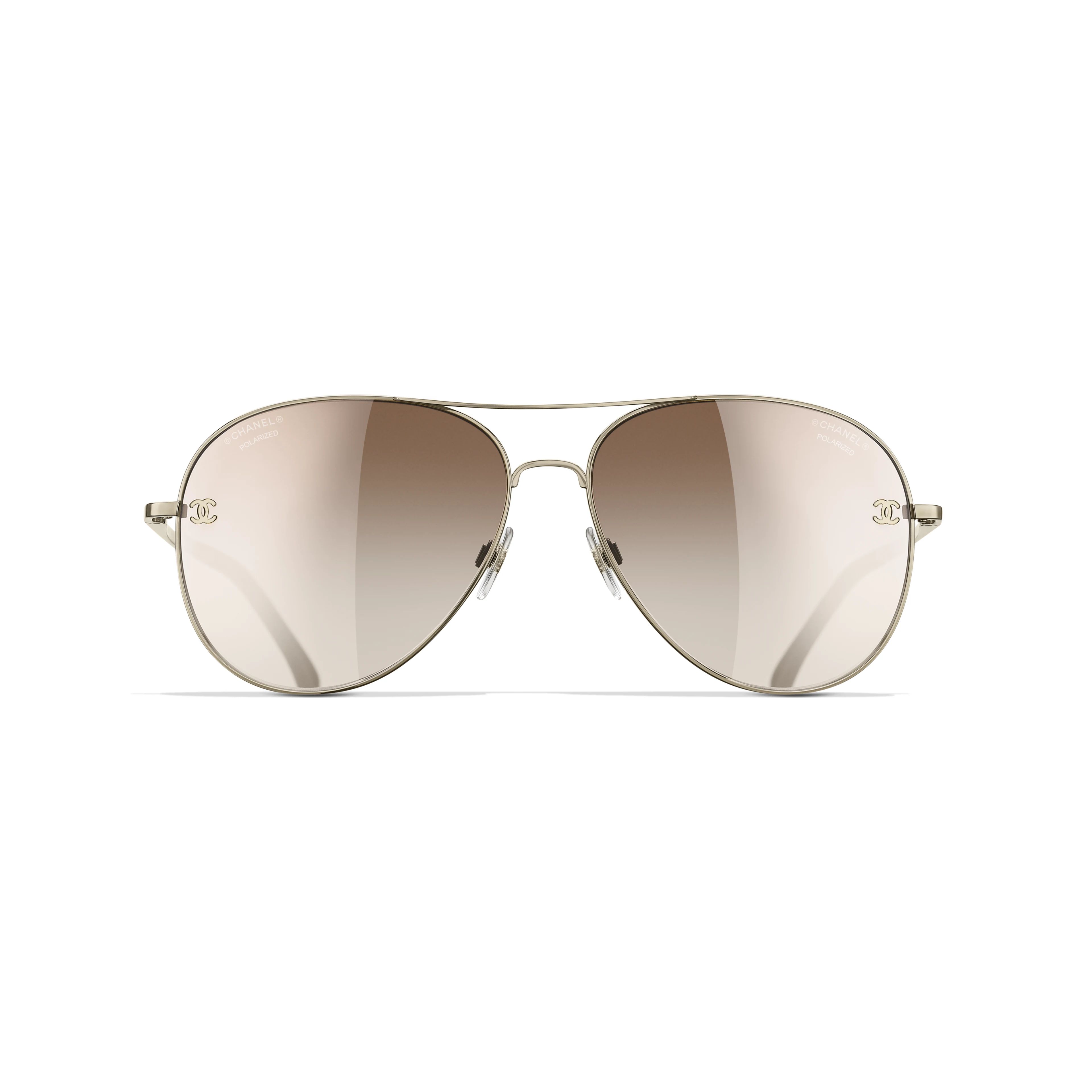 Pilot Sunglasses

            Titanium & Calfskin
	
		Gold. Lenses: Brown, Gradient | Chanel, Inc. (US)
