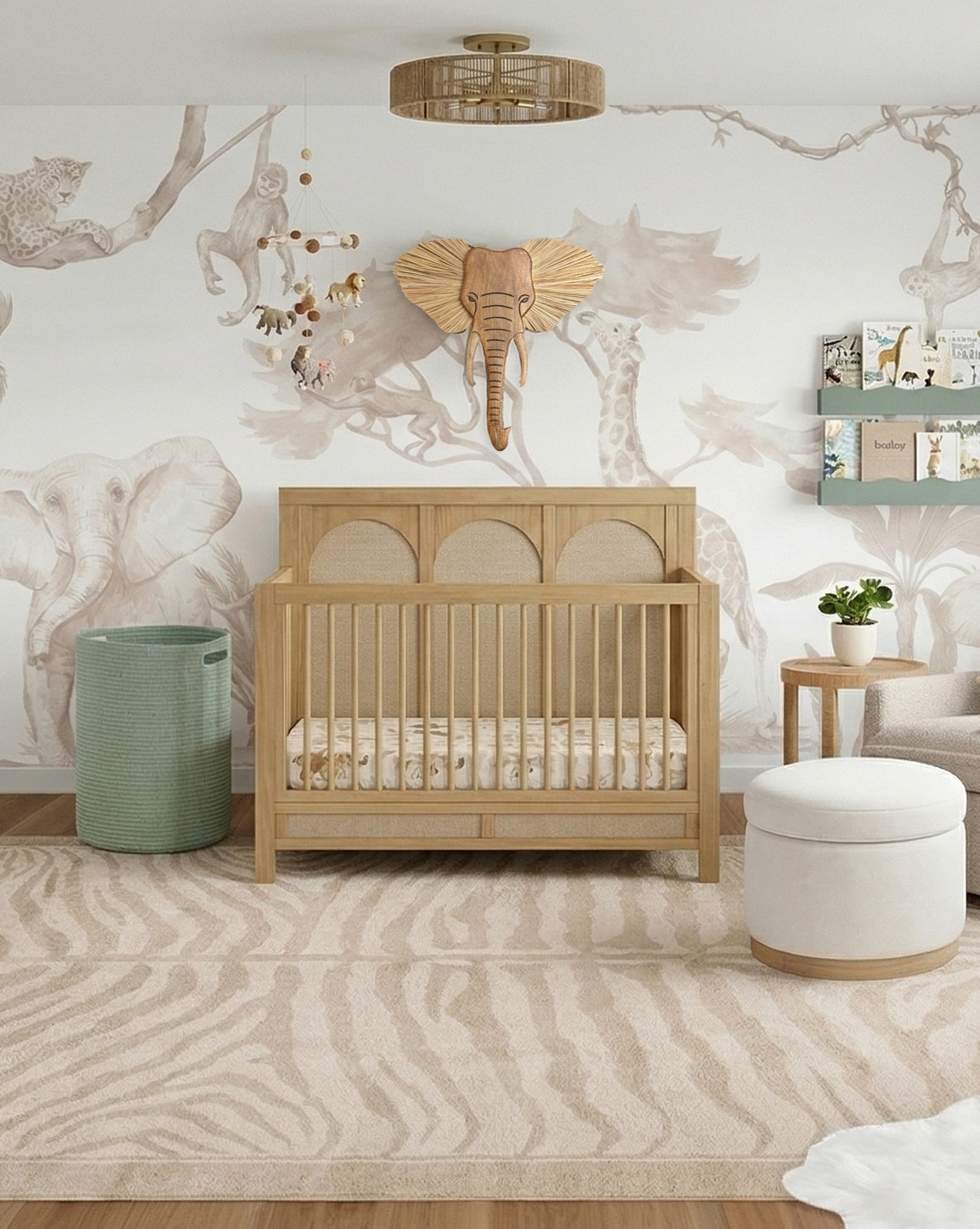 I designed this nursery for a client who wanted a safari nursery theme with a color palette of neutrals and sage green. This gender neutral nursery features a safari animal wall mural, blue floral wallpaper, a wood paneled crib, elephant wall decor, a woven storage bin, a storage ottoman, and sage green scalloped wall shelves.
✨🩶 Want a virtual nursery design of your own? Check out www.littlecrowninteriors.com for interior design services. 🩶 ✨ 
Design by Little Crown Interiors. For lots more neutral nursery ideas, check out my blog and website! 

 #nurserydecor #nurseryfurniture #nursery #babynursery #neutralnursery #safarinursery #nurserywallpaper #wallpaper #safariwallpaper #virtualdesign #edesign #littlecrowninteriors #LTKbump #LTKstyletip #LTKHome #LTKSaleAlert #LTKBaby