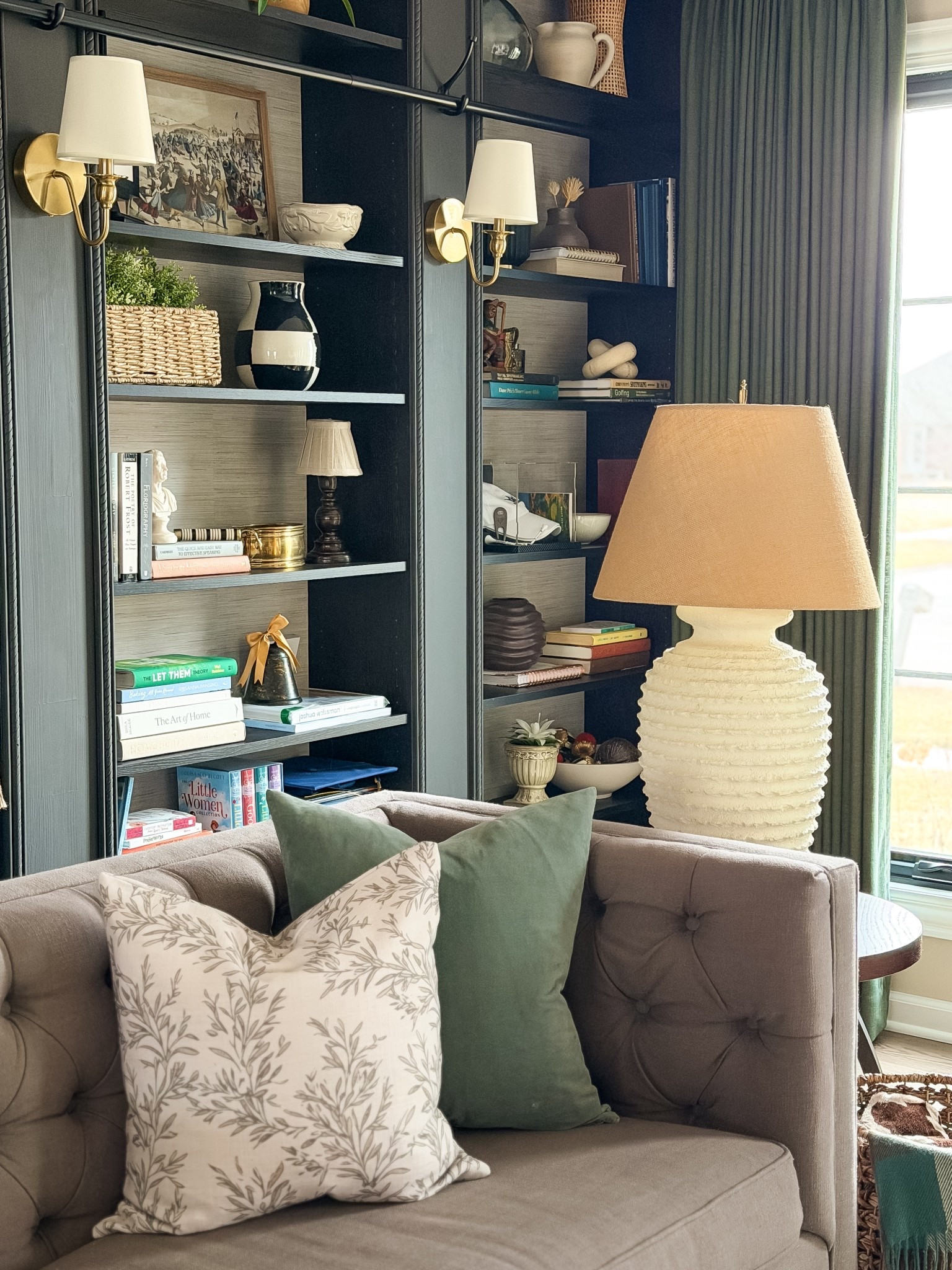 Cozy living room with neutral greens to start March. Home decor, table lamps, wall sconces, pillow covers, curtains, tufted sofa

#LTKmomlife #LTKHome #LTKSaleAlert