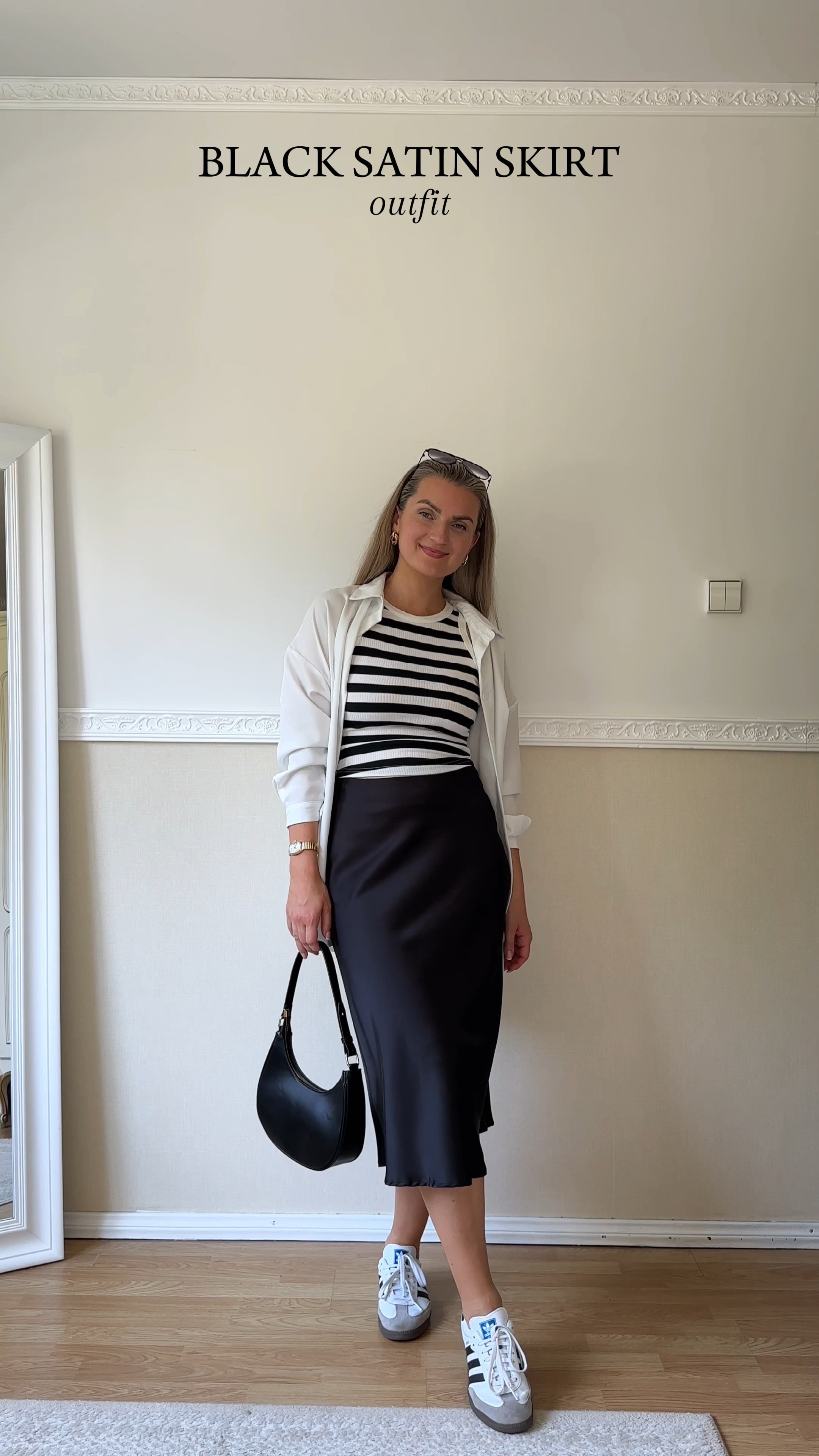 Black satin skirt outfit 🖤👟

Styling a black midi satin skirt with a striped black and white tank top, oversized white shirt, black mini shoulder bag and Adidas Samba OG for a simple dressy casual kind of look 🥰

#LTKStyleTip #LTKWorkwear #LTKFindsUnder100