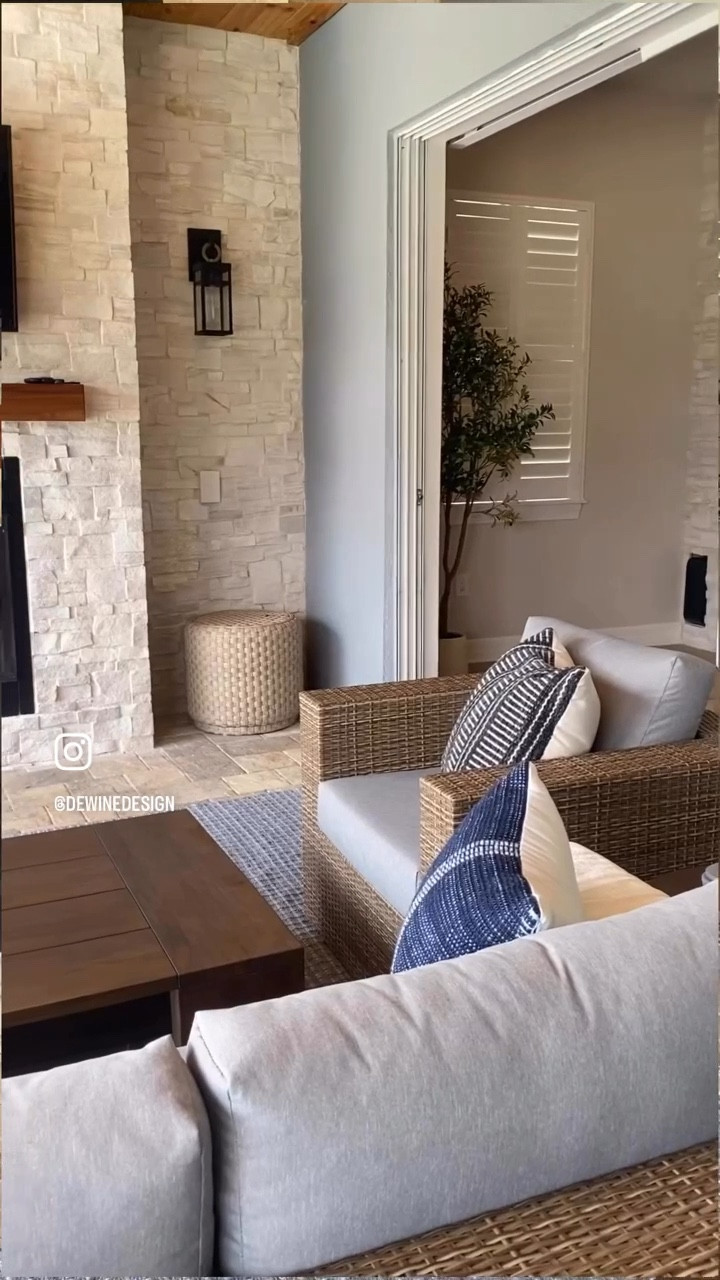 This lakeside outdoor living room started as your typical builder-grade blank slate—but we had other plans. From a custom fireplace wall to cozy, collected furnishings, our Weatherly Way project is now anything but basic. Tap to shop!