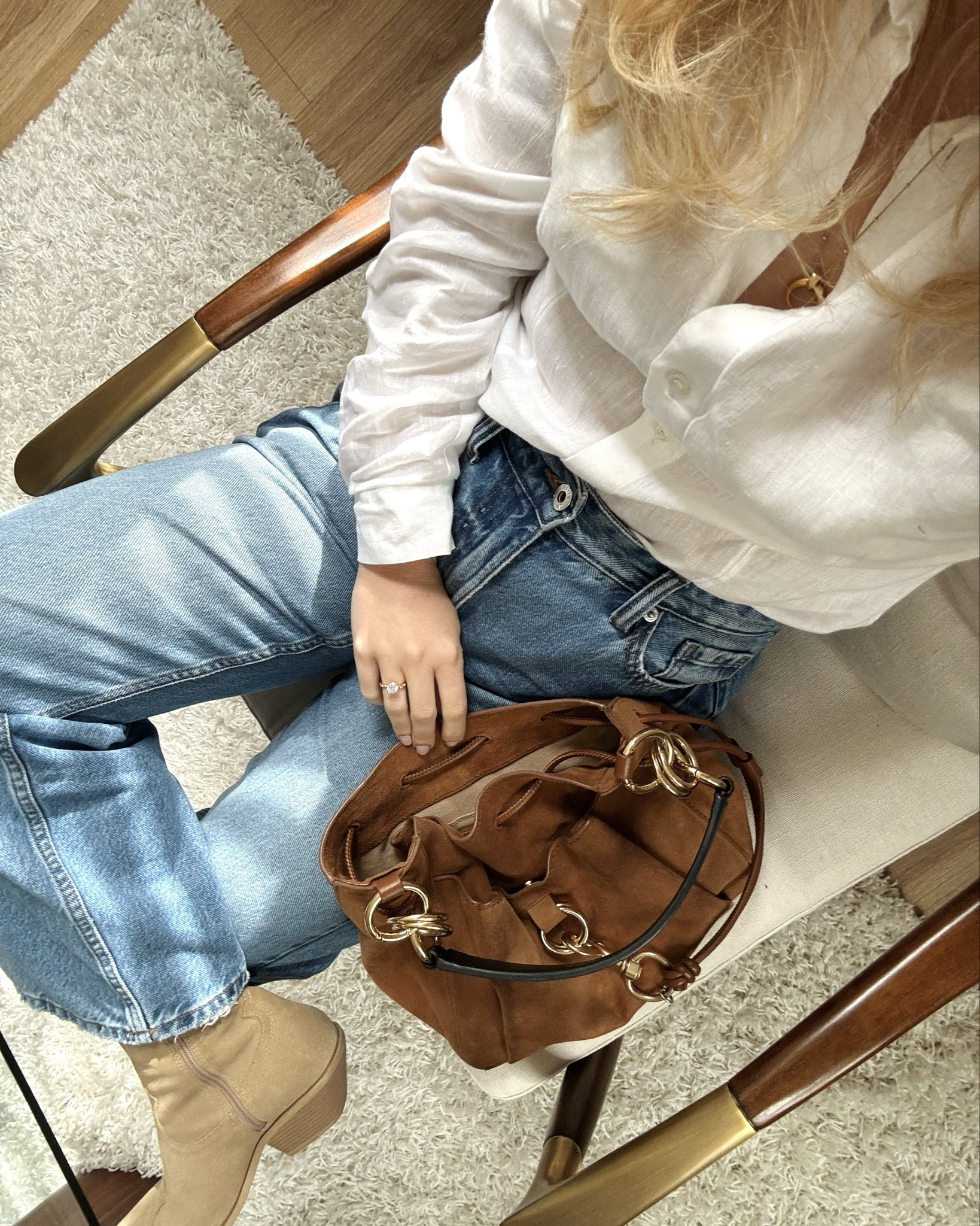 Summer spring country Nashville minimal outfit - petite blue jeans, linen shirt, western boots and a suede bucket bag! 

#LTKstyletip #LTKtravel #LTKitbag