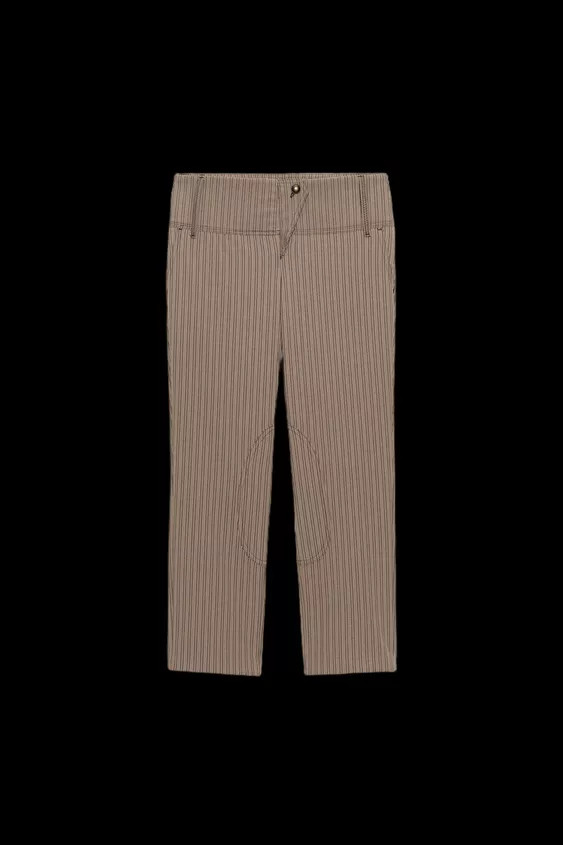 Mid-waist trousers featuring belt loops. Side pockets. Zip fly and metal button fastening. | Zara UK