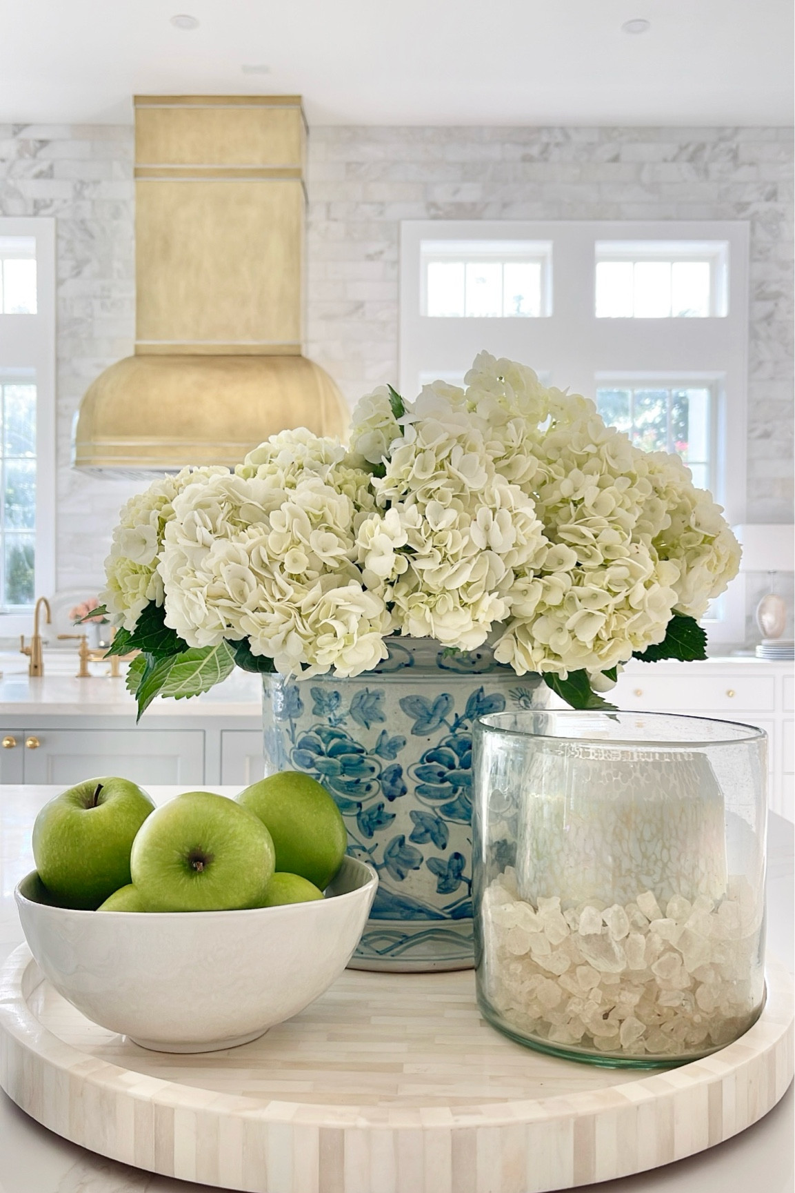 Kitchen home decor
Round tray, blue and white planter, glass hurricane, candle, bowl

#LTKhome
