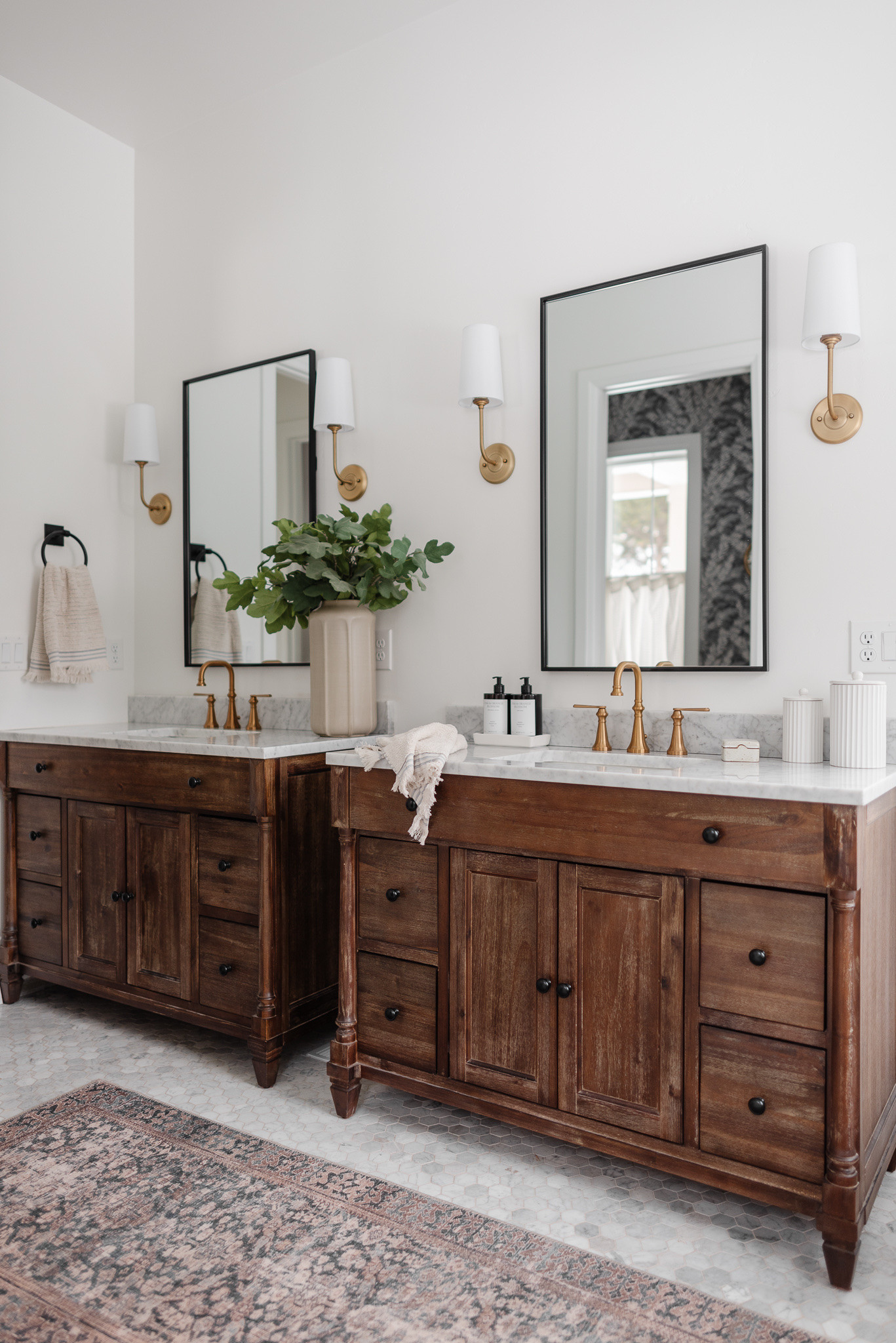 Primary bathroom that is both timeless and classic! Love our double vanities!


Bathroom inspo, bathroom vanity, wood bathroom vanity, primary bath, bathroom mirror, gold wall sconces, bathroom decor

#LTKHome