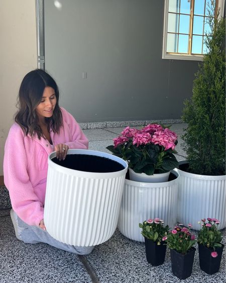 My new white planters are under $30 and the best dupe one 10x the price! Got a few of them for my front and back patio. 🩷
@walmart #walmarthome #WalmartPartner

Porch decor, white planter, white pot, gardening, Walmart, white flower pot, large planter, back patio decor, home decor, free people, pink jacket, pink fleece jacket, Christine Andrew 

#LTKfindsunder50 #LTKSeasonal #LTKhome