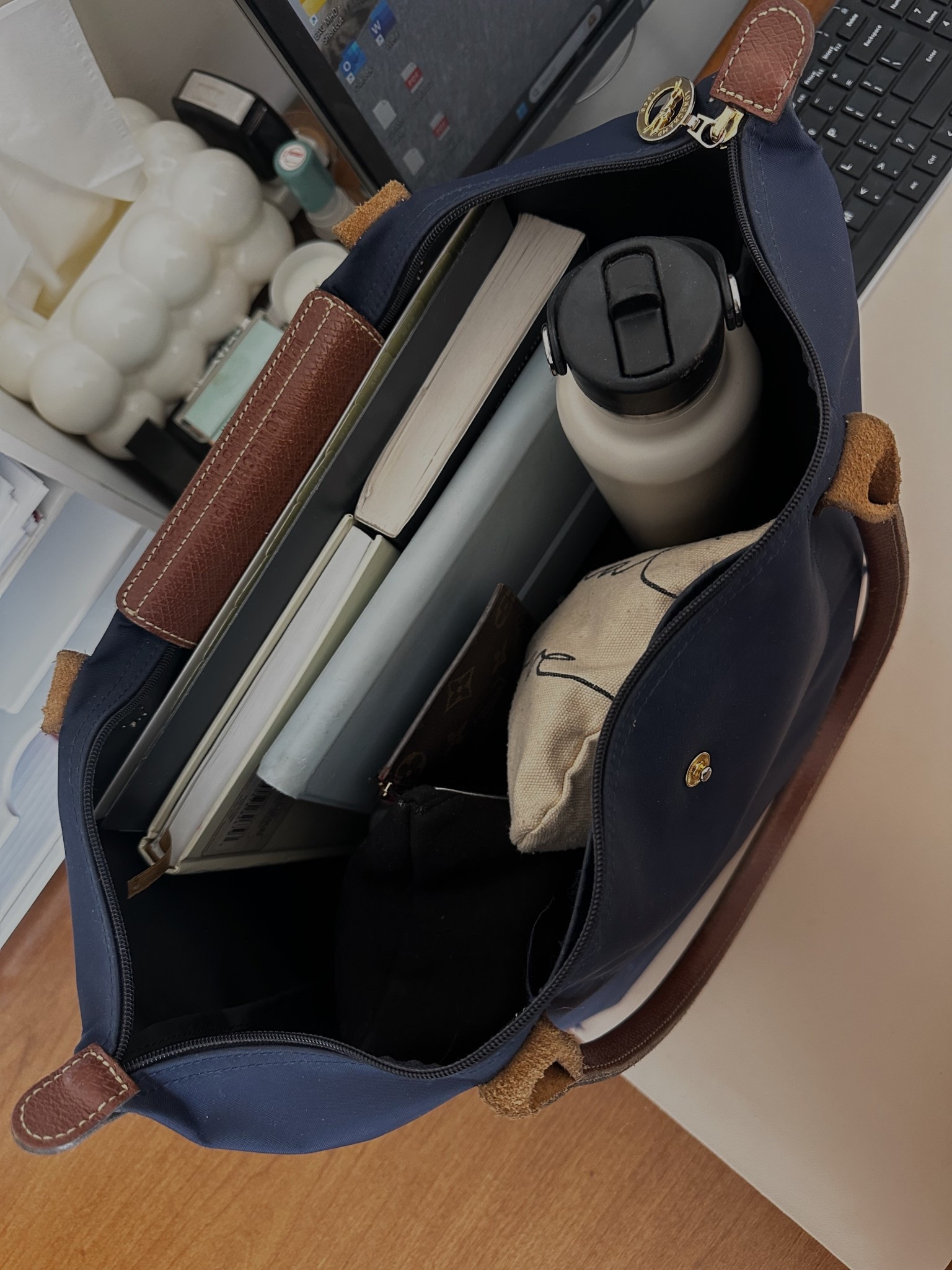 What’s in my work bag: laptop, planner, journal, water bottle, and mini makeup pouches  

#LTKStyleTip #LTKBeauty #LTKWorkwear