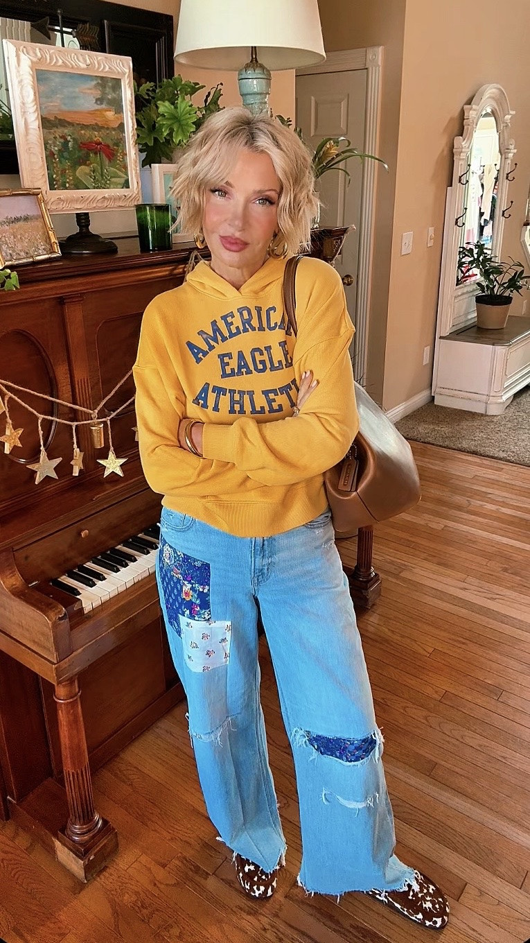 Sunshine, denim, and a little bit of vintage charm. ☀️💙

This outfit is an easy combination that still looks like you put in the effort. The buttery yellow American Eagle hoodie adds the perfect pop of color, paired with their wide leg patchwork jeans for a fun, laid back vibe. I finished it with my Coach Kisslock bag for a classic touch and my Rothy’s loafers because cute and comfortable will always win.

#LTKgrwm #LTKSeasonal #LTKSaleAlert