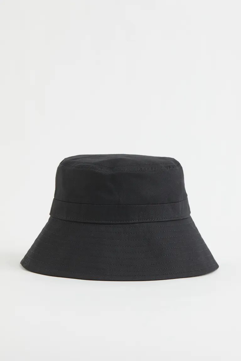 Bucket hat in woven cotton fabric with a sweatband and wide brim. | H&M (US + CA)