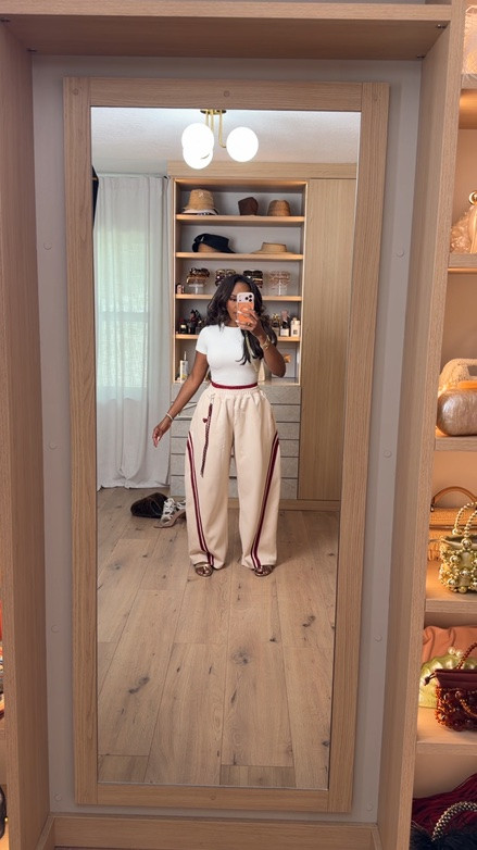 Hi Babes! 🤍❤️

Sporty meets chic with this elevated everyday look. These contrast stripe pants make a statement while still being incredibly easy to style. Paired with a simple fitted tee and heels, it’s the perfect mix of casual and polished.

✨ FIT DETAILS
• Relaxed wide-leg fit
• Contrast side stripe detail
• Comfortable elastic waist
• True to size

✨ WHERE TO WEAR THIS
• Casual lunch dates
• Weekend errands
• Travel days
• Coffee runs
• Girls' day out

The kind of outfit that looks effortless but gets all the compliments.

Everything is linked below!

xx Kira | IG: KirasFashionFinds

Measurements: 5'4" | 140 lbs | Size Small