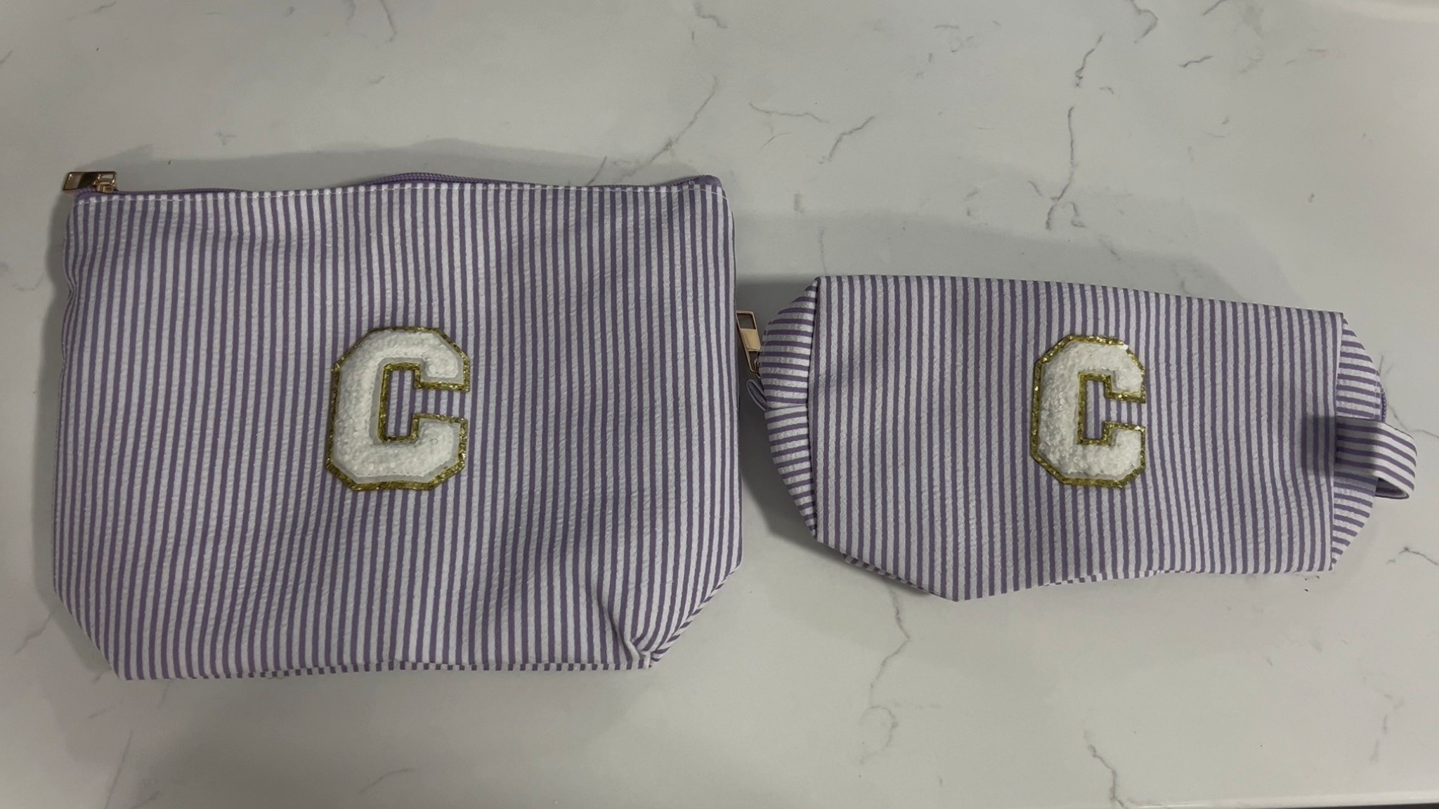 This initial toiletry set is so adorable!! Perfect set for a teen! I grabbed this for my niece and filling it full of her favorite hair/skin goodies!! 
I’m really impressed with the thick and durable quality! Such a great price and comes in two other colors!! The initial is made up there extremely well! The bigger pouch also has a pocket on the inside as well!! The smaller bag is a lot bigger once unzipped than you’d think! Perfect for teens, postpartum mama’s, or just something special for you!! Highly recommended this set!! 

#LTKGiftGuide #LTKBeauty #LTKgrwm