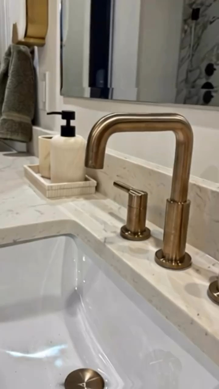 Daring design, stunning textures ✨
This bathroom masterfully blends bold contrasts with warmth, featuring bold marble patterned floors, dramatic dark cabinetry, and brushed brass accents that radiate sophistication. The rich wood vanity anchors the space, while fluted ceramic accessories and soft olive green towels add depth and nuance. Every element counts, and this design is all about harmony. Shop my lkn for the bathroom accessories.
#BathroomDesign #InteriorInspo #BoldInteriors #ModernClassic #TextureAndTone #DesignDetails #SBSDesignsAtlanta #classicmeetsmodern #warmwoodisin2025 #lovewhereyoulive #makinghomedreamshappen #lovewhereyoulive #atlantadesigner #lknhomes #targethomedecor

#LTKFindsUnder50 #LTKHome