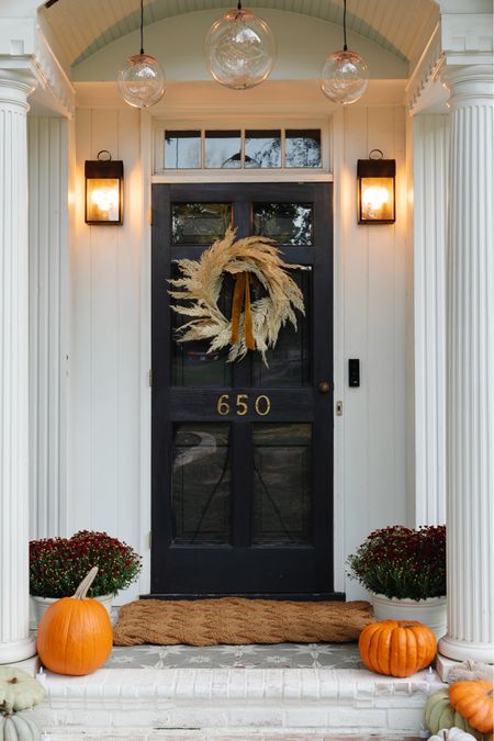 The fall porch is ready for cozy weather! This huge woven doormat from @shopterrain is the perfect size for a more grand entrance at a front door. Loving this wreath that pops against the dark door too. These battery operated orbs are so pretty to add a cozy glow to a porch for Halloween that would work well throughout the season and even into Christmas! #ad #shopterrain 

#LTKSeasonal #LTKstyletip #LTKhome