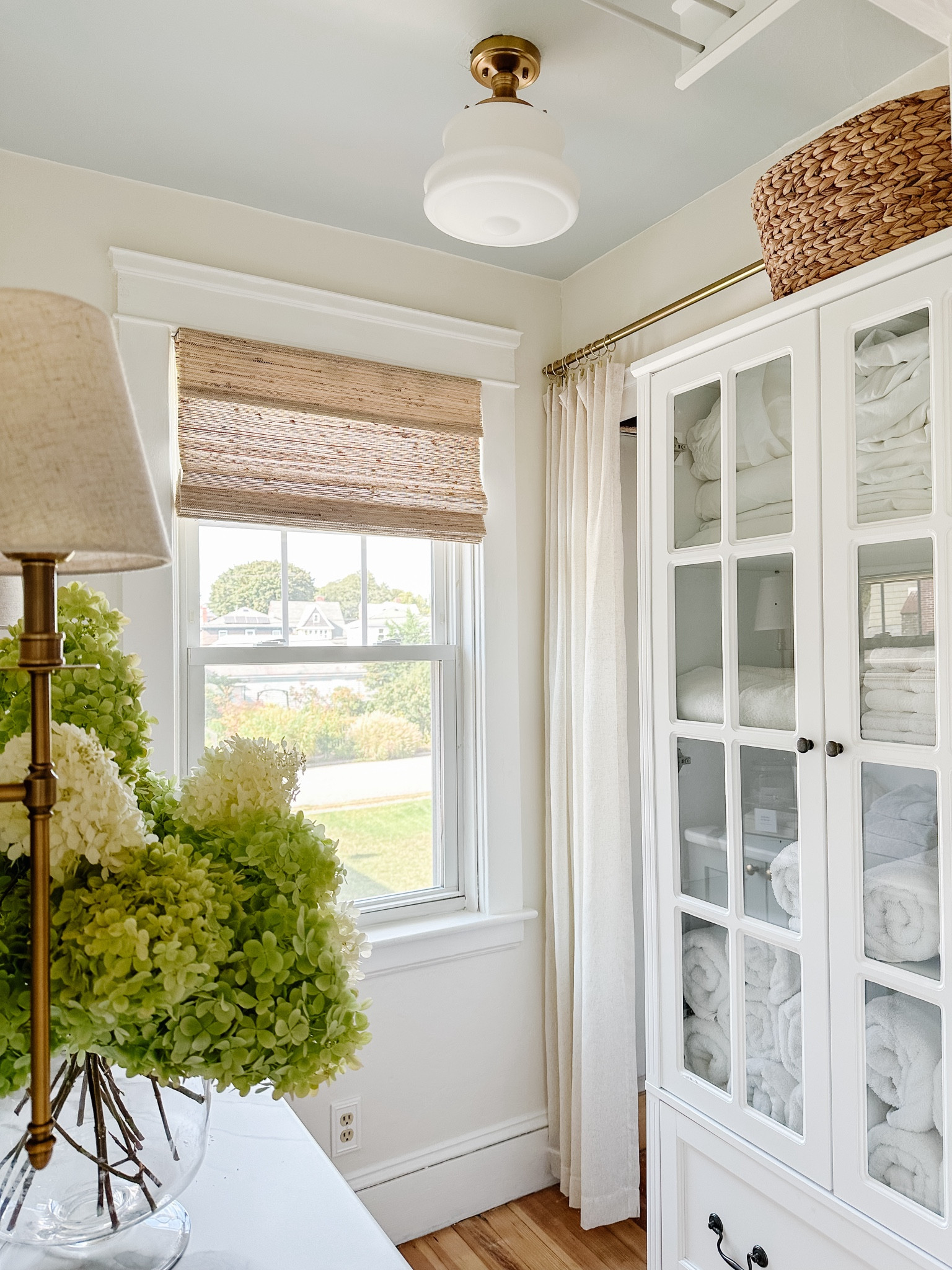 Laundry room details 

Linen cabinet with soft close drawers, natural ramie Roman shade, plug in sconces, stackable washer and dryer units 



#LTKHome #LTKSaleAlert #LTKVideo