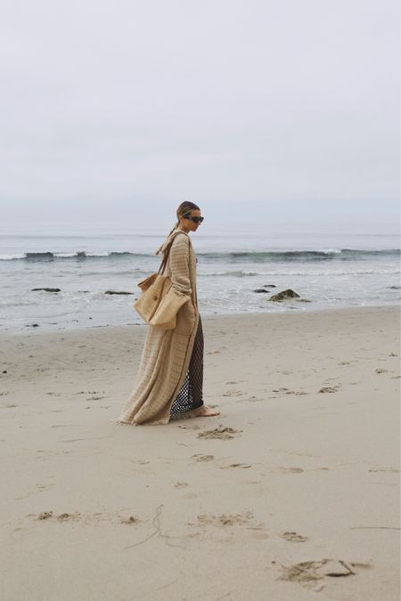 Moody like June Gloom

Wearing a Beach bohemian style fringed coat cotton with a fishnet skirt and rattan beach bag in Malibu

#LTKStyleTip #LTKItBag