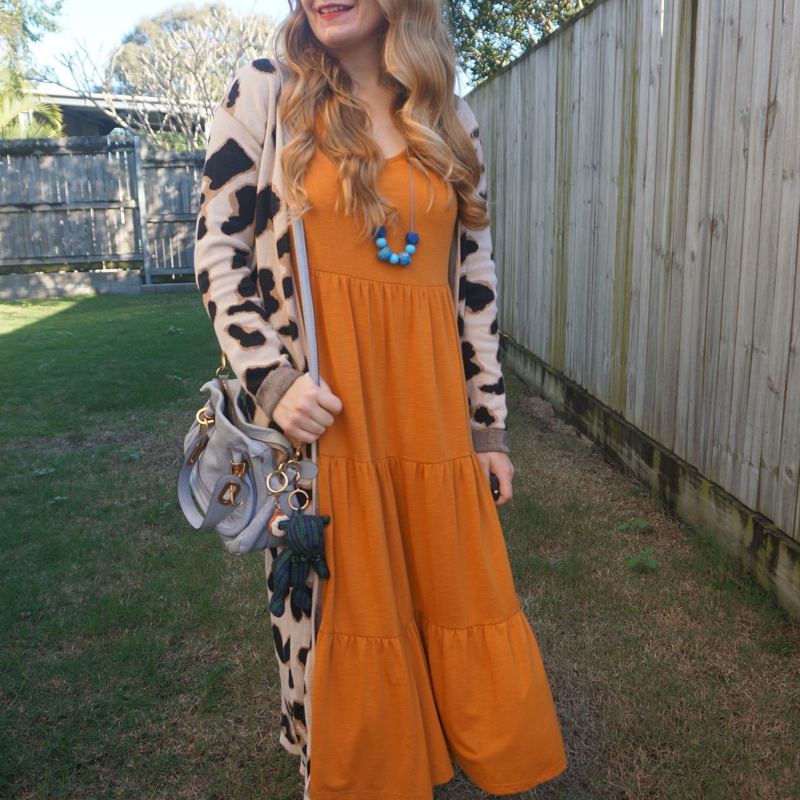 Orange tiered Anko Kmart midi dress with leopard print maxi cardigan and periwinkle blue Chloe Paraty bag 💙🧡

#LTKaustralia #LTKwinter #LTKbag