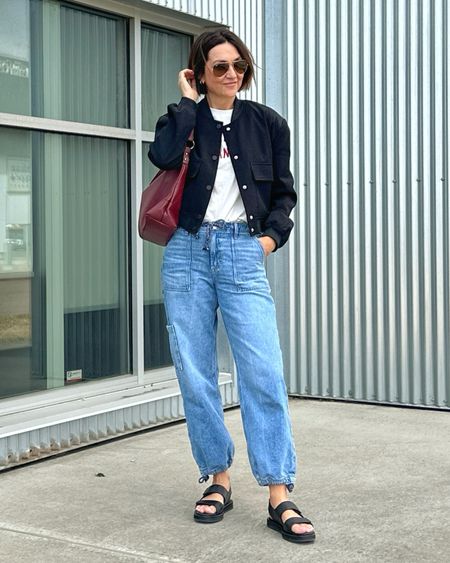 Casual spring outfit… bomber jacket and graphic tee fit tts, so do these denim cargo joggers. 
Sandals are a splurge but amazing quality and so comfortable and fit tts.
I also linked a few similar more affordable options 


#LTKshoecrush #LTKitbag #LTKstyletip