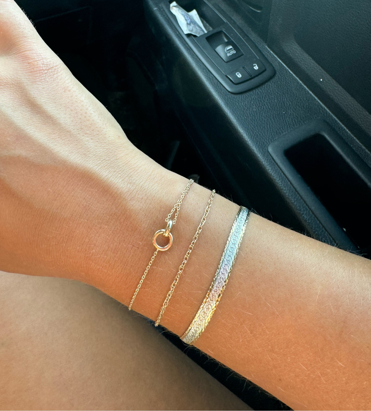 the middle bracelet is a permanent bracelet & the herringbone one is from a pawn shop 😋