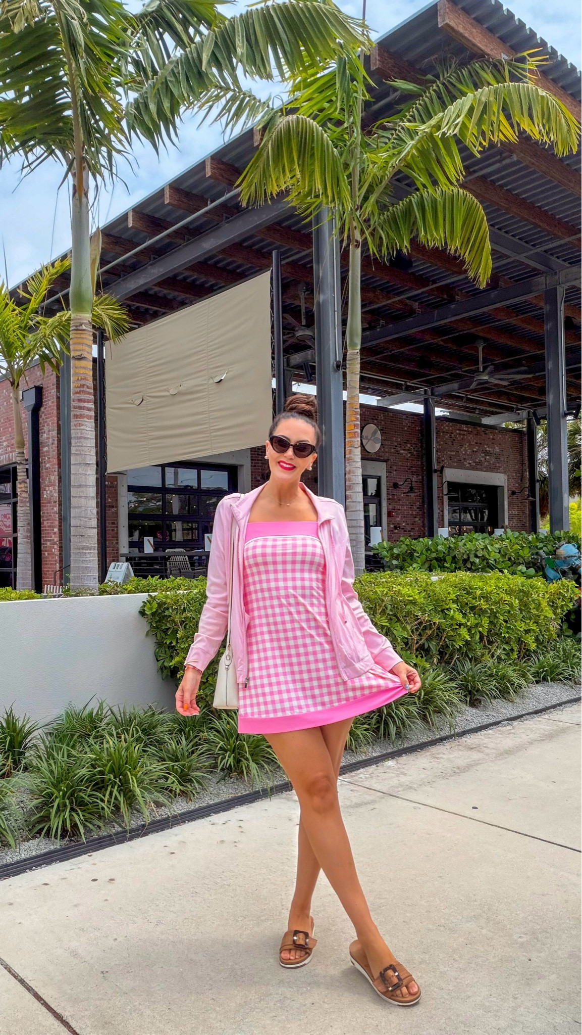 This pink gingham active dress is your new go-to for a casual spring outfit! 🌸 This Target active court dress offers a sporty chic outfit vibe, perfect for everyday spring style or a weekend outfit. I've paired this athletic mini dress with a cute white crossbody Kate Spade bag, stylish + affordable designer cateye sunglasses, and comfy platform slide sandals for an easy outfit idea. It even has built-in shorts!

#LTKootd #LTKSaleAlert #LTKSeasonal