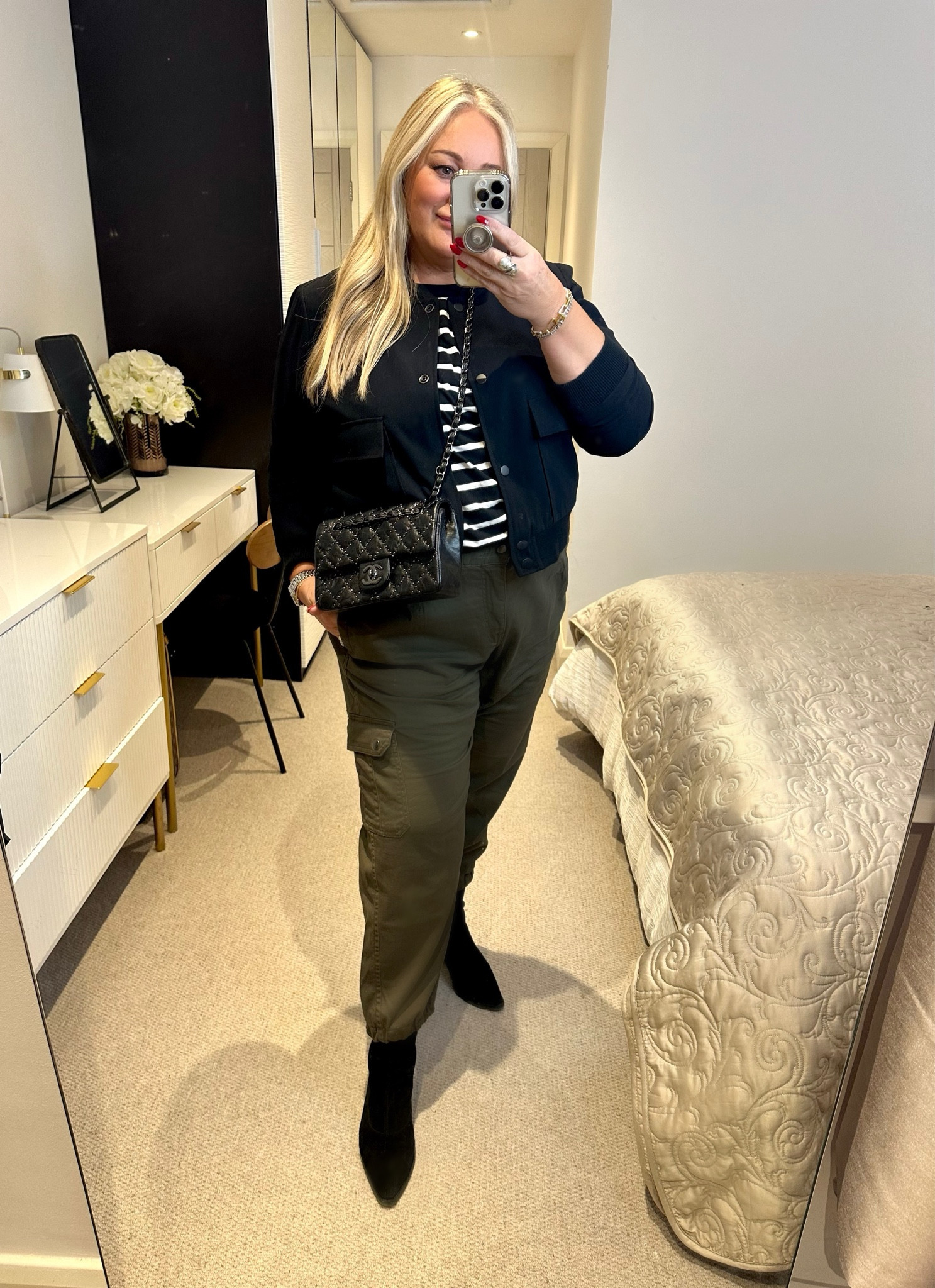 Easy Off Duty 🙌🏻

Why It Works : 
The point boots add (much needed) length to my legs.
The stripe top, tucked in balances my top half.
The black bomber will be worn on repeat. 
I could swap out the tee for plain white & add trainers for when ankles out is acceptable. 
The cargos could be dressed up with a chiffon blouse & strappy metallic heels.

#LTKstyletip #LTKmidsize #LTKSeasonal